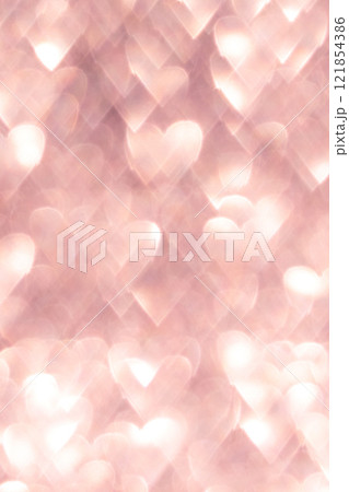 Pink abstract background with heart shaped bokeh lights creating a romantic vibe 121854386