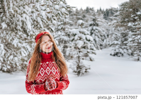 Happy Woman in Snow Covered Winter Forest Happy Woman in Snow Covered Winter Forest 121857007