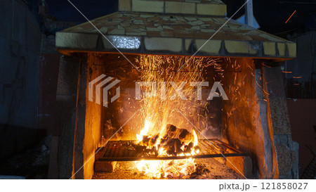Fireplace preparing argentinian roast meat Fireplace preparing argentinian roast meat 121858027