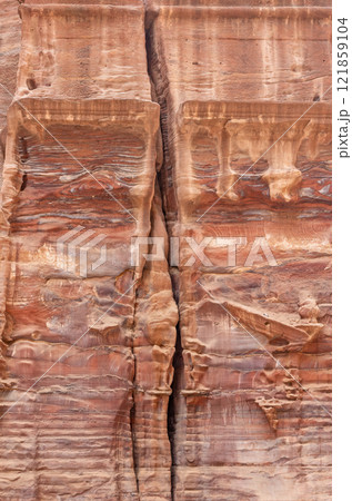 Remains of columns in the rock. Archaeological. site Petra in Jordan. 121859104