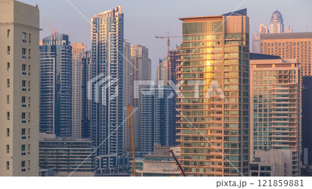 Aerial view of Dubai Marina from a vantage point at sunset timelapse. 121859881