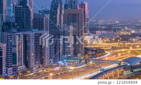 Dubai Marina skyscrapers aerial top view before sunrise from JLT in Dubai night to day timelapse, UAE. Dubai Marina skyscrapers aerial top view before sunrise from JLT in Dubai night to day timelapse, UAE. 121859894