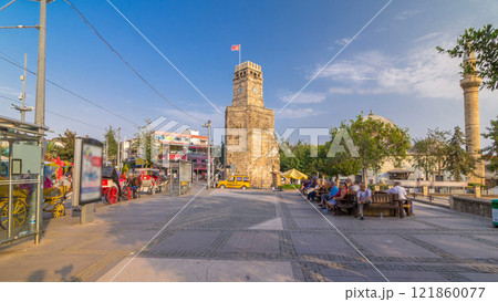 Clock tower in the Historic part of Antalya Kaleici timelapse hyperlapse, Turkey. Old town of Antalya is a popular destination among tourists 121860077