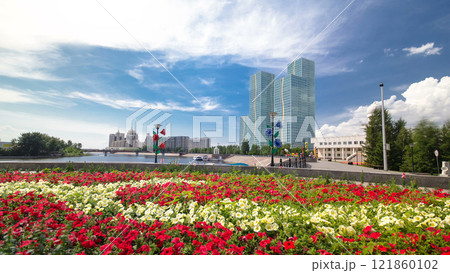 Flowerbed with red and yellow flowers on embankment timelapse hyperlapse. Astana, Kazakhstan Flowerbed with red and yellow flowers on embankment timelapse hyperlapse. Astana, Kazakhstan 121860102