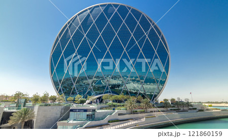 Circular skyscraper Aldar Headquarters Building timelapse hyperlapse in Abu Dhabi, UAE. Circular skyscraper Aldar Headquarters Building timelapse hyperlapse in Abu Dhabi, UAE. 121860159