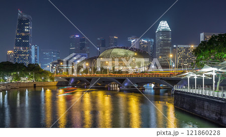 Illuminated Double Esplanade Theatres domes behind Esplanade Drive with traffic night timelapse hyperlapse 121860228