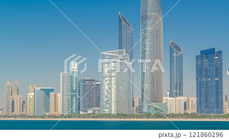 View of high skyscrapers on a corniche in Abu Dhabi stretching alongside the business center timelapse hyperlapse. View of high skyscrapers on a corniche in Abu Dhabi stretching alongside the business center timelapse hyperlapse. 121860296