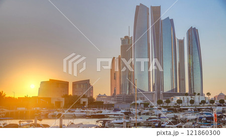 Al Bateen marina Abu Dhabi timelapse with modern skyscrapers on background Al Bateen marina Abu Dhabi timelapse with modern skyscrapers on background 121860300