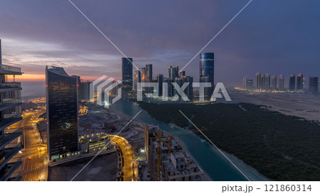 Buildings on Al Reem island in Abu Dhabi timelapse from above. Buildings on Al Reem island in Abu Dhabi timelapse from above. 121860314