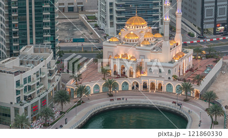 Modern residential architecture of Dubai Marina and Mohammed Bin Ahmed Almulla Mosque aerial day to night timelapse Modern residential architecture of Dubai Marina and Mohammed Bin Ahmed Almulla Mosque aerial day to night timelapse 121860330