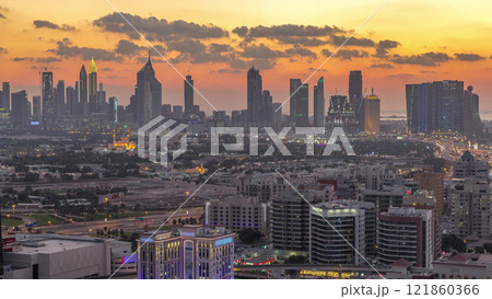 View of transition from day to night in Dubai city, United Arab Emirates Timelapse Aerial 121860366