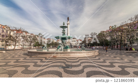Rossio square with fountain and monument on column located at Baixa district timelapse hyperlapse in Lisbon, Portugal 121860395