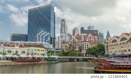 Tourist boats docking at Clarke Quay habour timelapse hyperlapse. 121860401