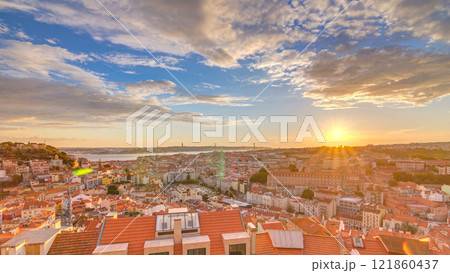 Lisbon at sunset aerial panorama view of city centre with red roofs at Autumn evening timelapse, Portugal Lisbon at sunset aerial panorama view of city centre with red roofs at Autumn evening timelapse, Portugal 121860437