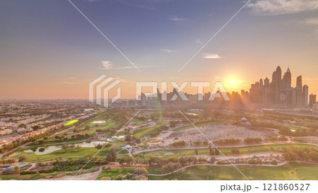 Dubai Marina skyscrapers and golf course sunset timelapse, Dubai, United Arab Emirates 121860527