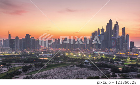 Dubai Marina skyscrapers and golf course day to night timelapse, Dubai, United Arab Emirates 121860528