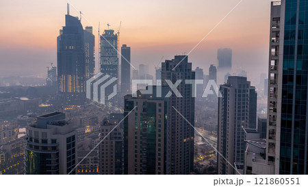 Foggy morning in downtown of Dubai night to day timelapse. 121860551