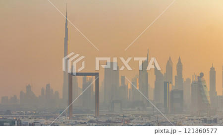 Dubai creek landscape timelapse with waterfront and modern buildings in the background during sunset Dubai creek landscape timelapse with waterfront and modern buildings in the background during sunset 121860577