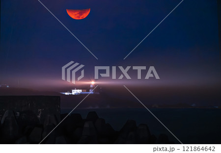 Winter Night Moon and Lighthouse Glow at Fugui Cape, Taiwan. 121864642