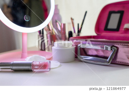 Lip gloss an set of make-up and skin care products .Feminine beauty concept 121864977