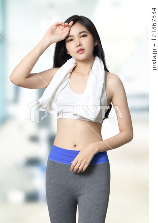 young asian woman in sportwear relax at fitness gym background young asian woman in sportwear relax at fitness gym background 121867334