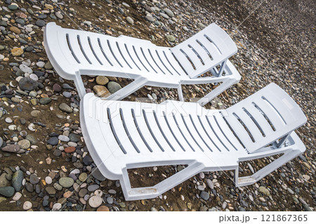 Sun beds on the beach 121867365