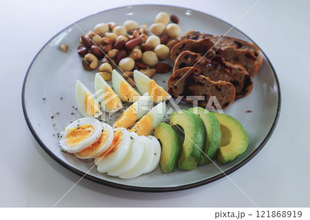 walnut cranberry sourdough bread or cranberry sourdough with boiled egg , avocado and nuts 121868919