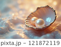 Elegant pearls in a golden seashell on shimmering surface 121872119
