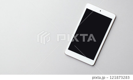 Minimalist tablet mockup on gray surface, perfect for presentations 121873283