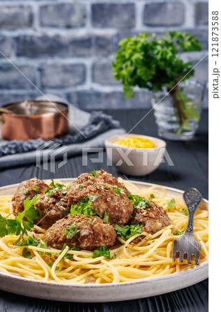 pork burger steak with spaghetti on a plate 121873588