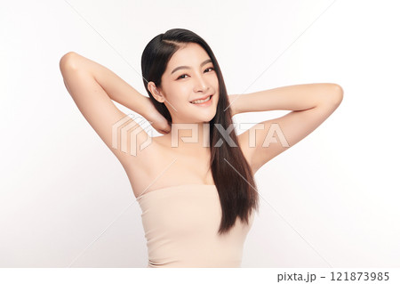 Beautiful Young Asian woman lifting hands up to show off clean and hygienic armpits or underarms on white background, Smooth armpit cleanliness and protection concept Beautiful Young Asian woman lifting hands up to show off clean and hygienic armpits or underarms on white background, Smooth armpit cleanliness and protection concept 121873985