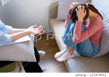 A psychiatrist counseling and consulting her patient 121874031