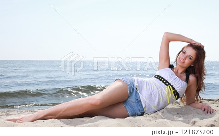 Beach holidays woman enjoying summer sun sand looking happy Beach holidays woman enjoying summer sun sand looking happy 121875200