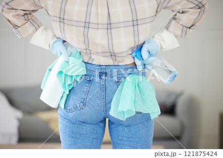 Hygiene cleaning, chores and sanitize for a clean and fresh home. Closeup of a woman, cleaner and housekeeper ready to disinfect with detergent, spray and cloth during routine household task Hygiene cleaning, chores and sanitize for a clean and fresh home. Closeup of a woman, cleaner and housekeeper ready to disinfect with detergent, spray and cloth during routine household task 121875424