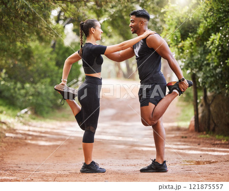 Fitness, active and healthy couple stretching, exercising or training together outside park. Sporty and supportive man and woman preparing for workout exercise, warmup routine or jogging in nature 121875557