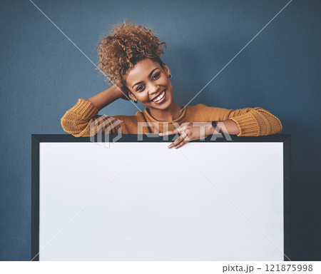 Woman showing blank poster, copy space board and placard sign to promote, market and advertise opinion or voice on voting democracy. Portrait of smiling, young and happy lady endorsing with billboard 121875998