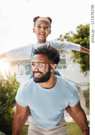 Piggyback, playful and young father with his child bonding outdoors in the garden at home. Happy male and his daughter enjoying quality time together. Smiling girl and man playing outside in spring. Piggyback, playful and young father with his child bonding outdoors in the garden at home. Happy male and his daughter enjoying quality time together. Smiling girl and man playing outside in spring. 121876296