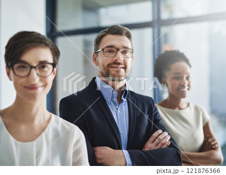 Proud and happy leadership of a business on a mission to achieve the company vision and growth. Portrait of a team of colleagues with a positive mindset smiling and standing in unity or support 121876366