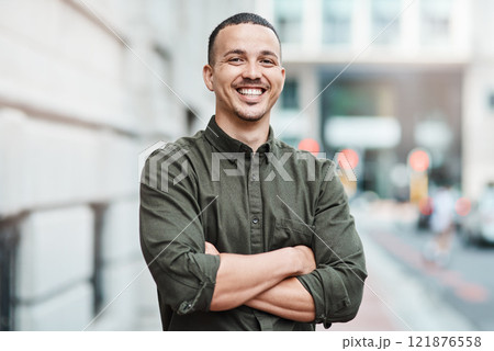 Business man standing with arms crossed, looking confident and proud in the city alone. Portrait of a black male entrepreneur or worker showing vision, ambition and success with arms folded downtown 121876558