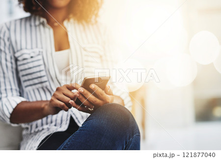 Hands texting on phone, browsing social media or searching internet while waiting for job interview or new opportunity in creative office. Closeup of business woman working on startup website on tech 121877040
