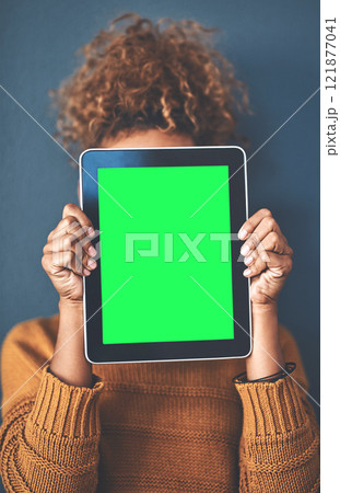 Green screen, copy space and chromakey on a tablet of a woman showing website for online advertising. Closeup of female with blank touch screen, branding for a business logo or news and marketing Green screen, copy space and chromakey on a tablet of a woman showing website for online advertising. Closeup of female with blank touch screen, branding for a business logo or news and marketing 121877041