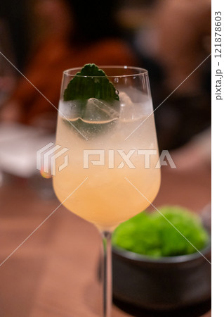 A glass of cocktail on the table 121878603