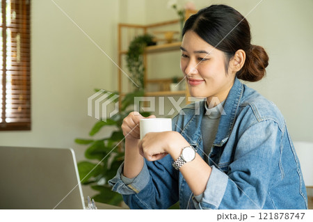 Young female architect taking a break from work. Young female architect taking a break from work. 121878747
