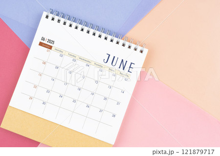 June 2025 month desk calendar on colorful background. June 2025 month desk calendar on colorful background. 121879717
