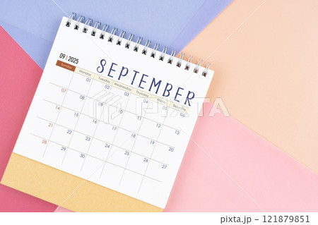 September 2025 month desk calendar on colorful background. 121879851