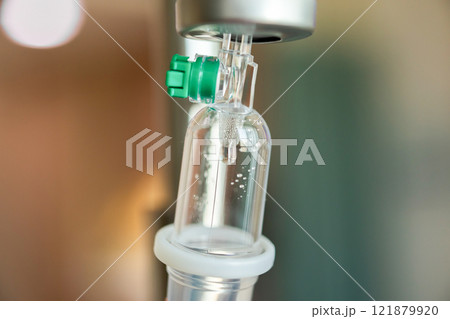 Close up medical intravenous IV drip in hospital background Close up medical intravenous IV drip in hospital background 121879920