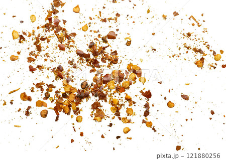 dried red chili pepper flakes and seeds isolated on white background 121880256