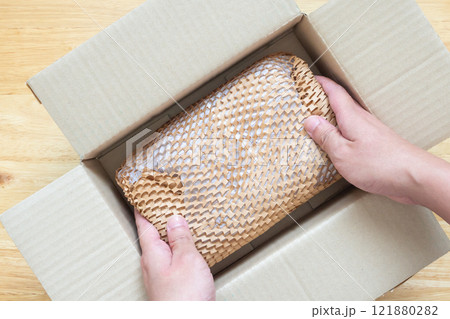 Eco friendly brown paper honeycomb wrap for product packaging parcel carton box 121880282