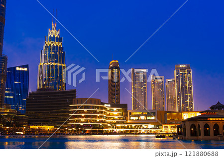 Panoramic skyline and modern commercial buildings with empty lagoon. cityscape at night. High quality photo Panoramic skyline and modern commercial buildings with empty lagoon. cityscape at night. High quality photo 121880688