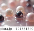 Soft pink, black and white pearls with glowing highlights 121881540